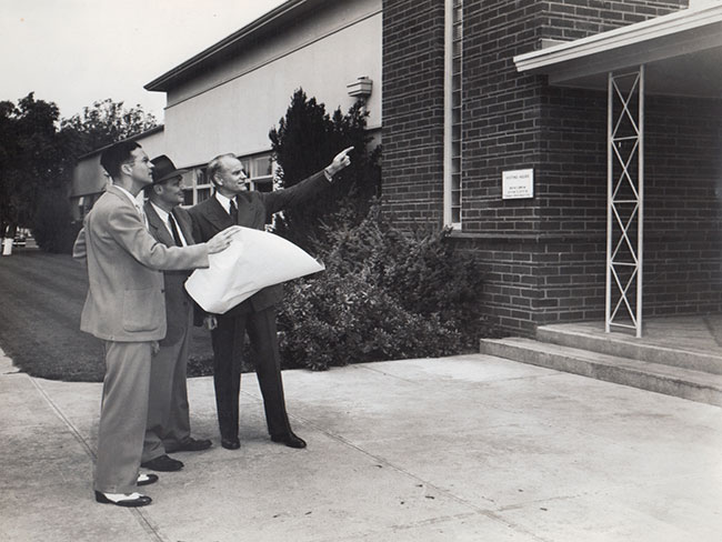 Frank Stewart, administrator; George Wolff, architect, Dr. Wallace Neighbor (pointing); Northern Permanente Foundation Hospital, circa 1942.