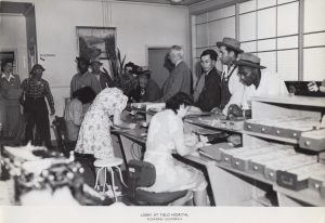 1943 image of the lobby of the Richmond Field Hospital, filled with patients.