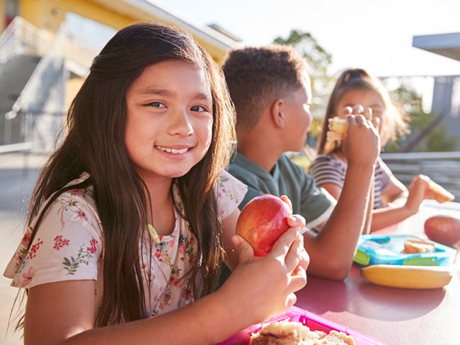 children at school eating lunch