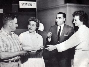 Health assessment staff greet a longshoreman ready for his battery of tests, 1961.