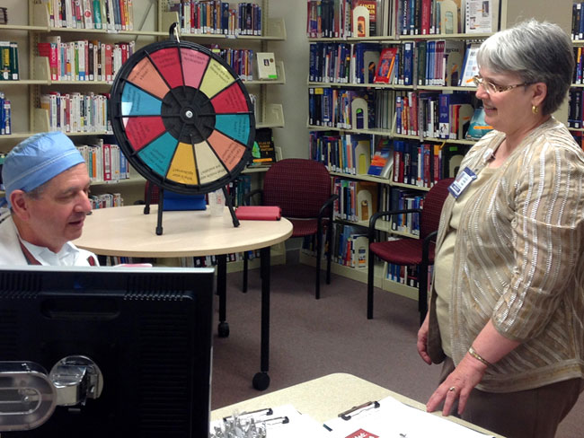 Carolyn Fishel and Walnut Creek Physician collaborating on a literature search, 2014 (photo courtesy Eve Melton)