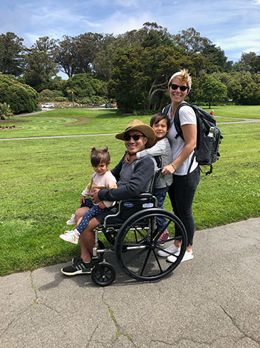 Cheong and family pose for picture in wheelchair