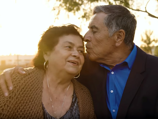 Miguel and Paula Rodriguez hugging each other.