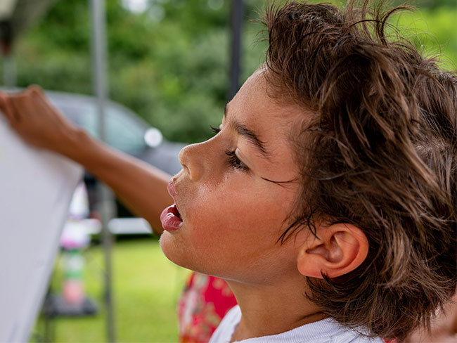 Boy sweating on a hot day