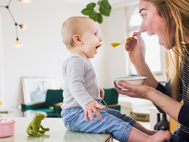 baby mimicking mom while eating.