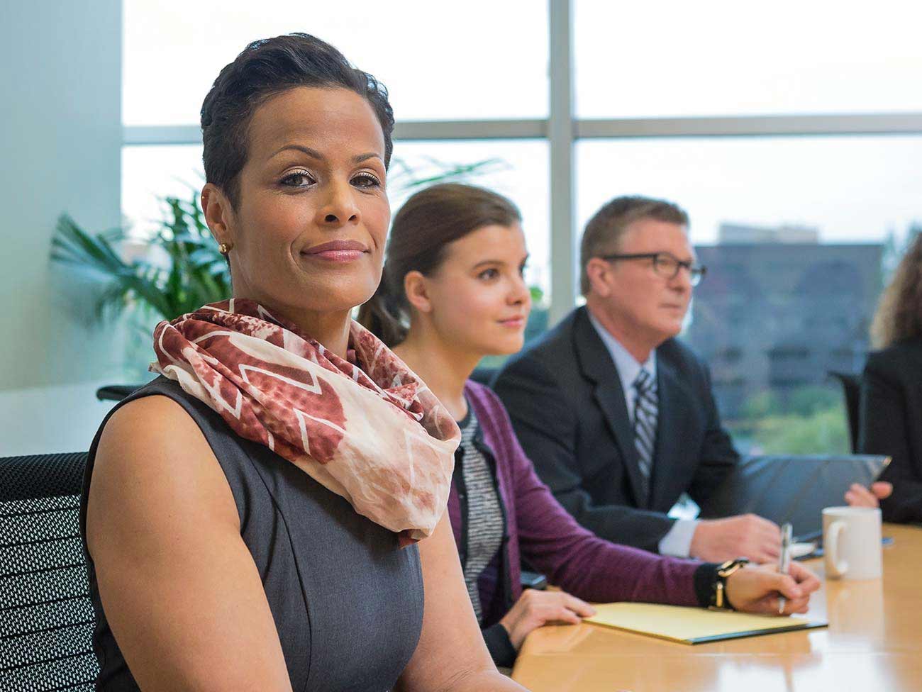 woman seated inside conference room 