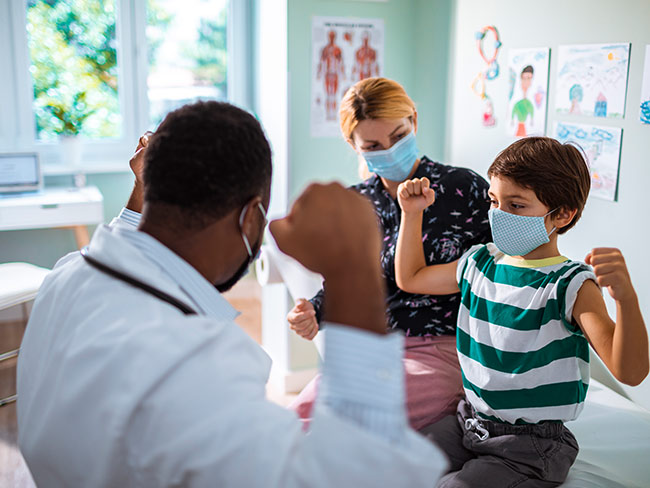 Doctor and boy during a checkup.