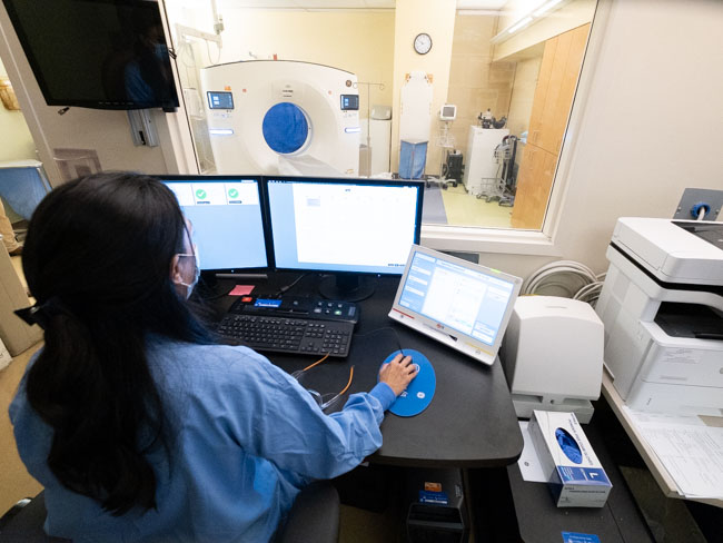 Jennifer Speirs, chief CT technologist, processes scans.