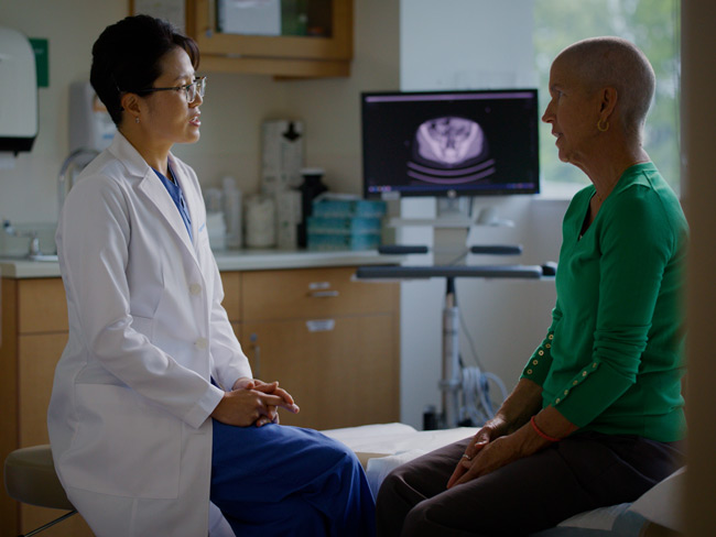 Jenny Wong, MD, with Donna Budway in an exam room