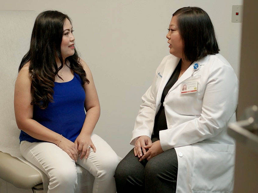 Maria Cobos and Dr Brooke Vuong in consult in a waiting room