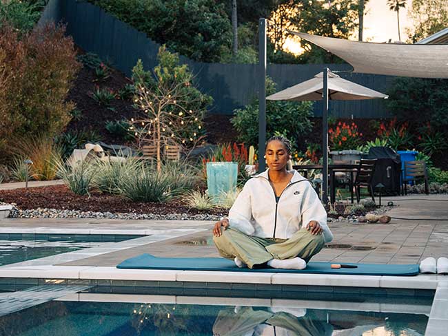 Naomi meditating outdoors