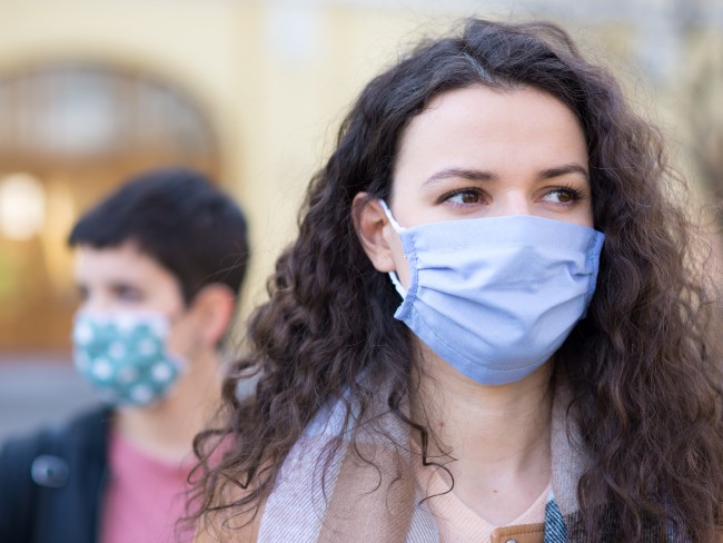 Two women wearing a mask 