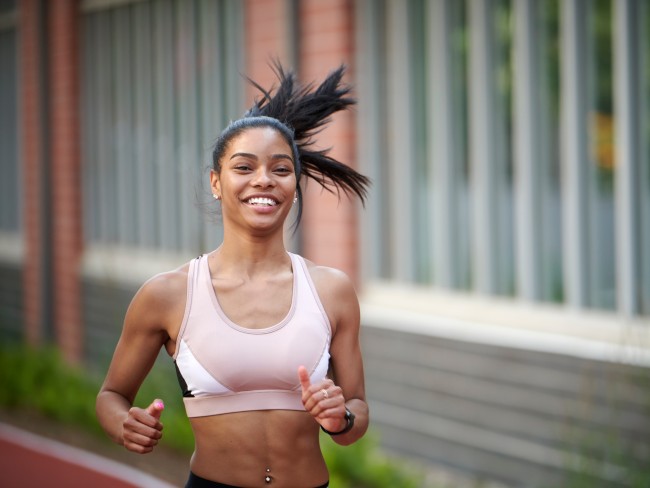 Woman running on a track