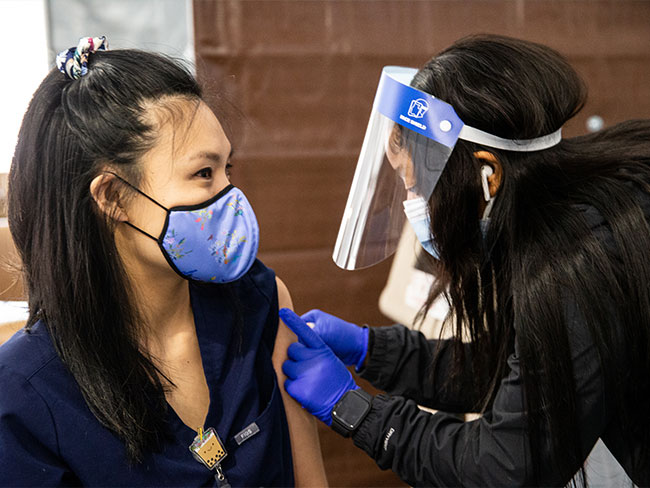 Kaiser Permanente nurse receives the COVID-19 vaccine