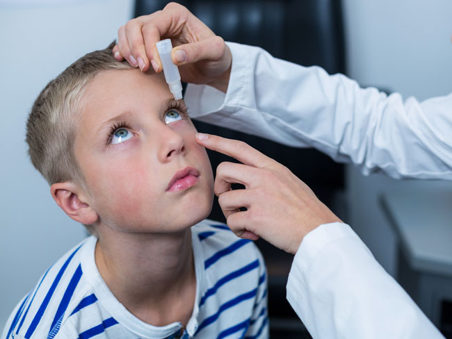 Patient receiving eydrop therapy