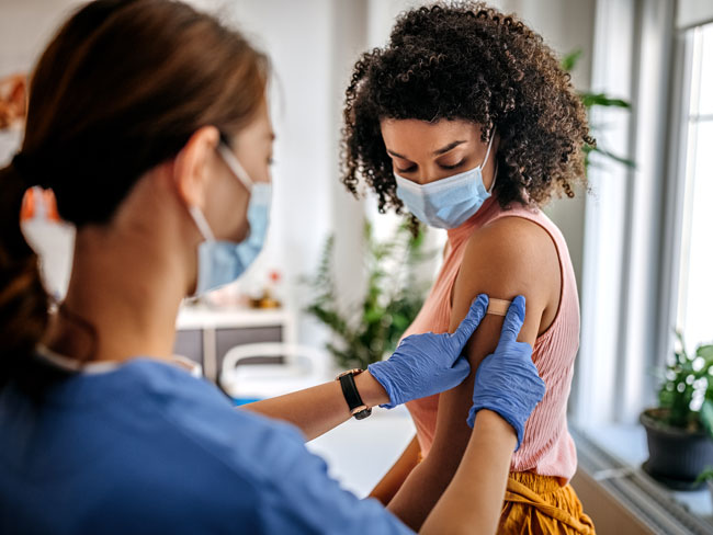 Woman receiving a vaccine