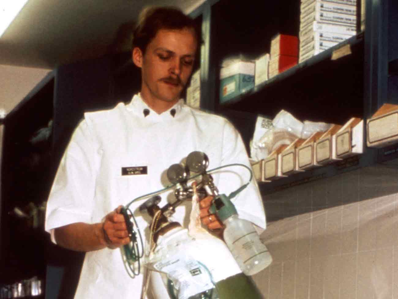 Medical specialist handling oxygen therapy equipment 