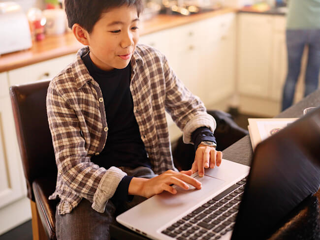 asian boy on laptop 