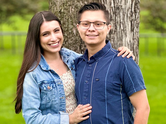 Tatiana Oliva wraps her arm around the shoulder of her husband, Gabriel Abarca.