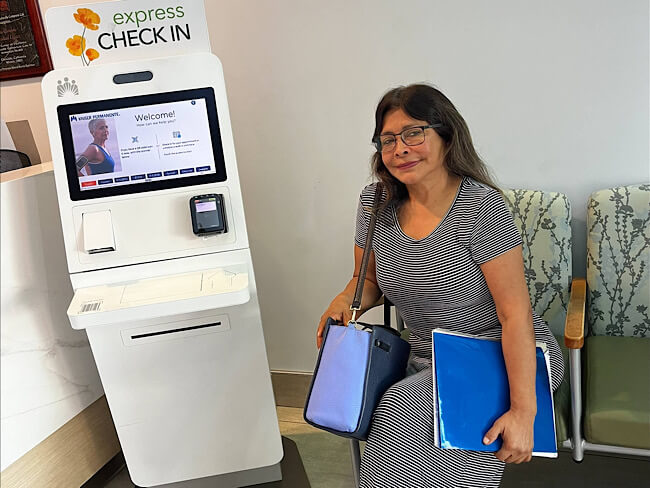 Kaiser Permanente member Isabela Tevanyan sitting in a medical office waiting room.