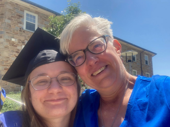 Shannon Parkin smiling with her daughter at her daughter's college graduation