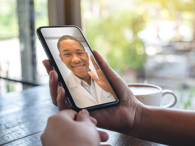 physician appearing on the phone screen of a patient during a telehealth visit