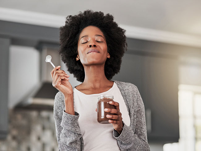 woman enjoying a sweet treat without remorse