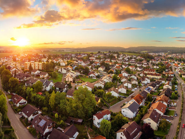 Sun rising over a suburban neighborhood. 