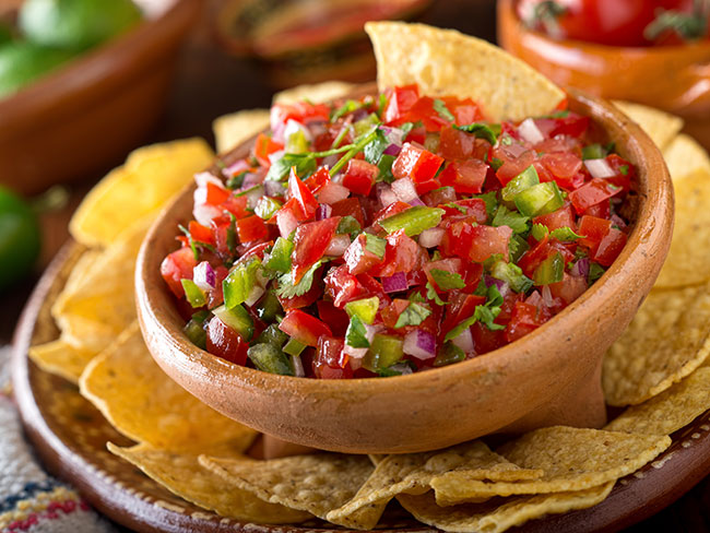 A delicious home made salsa pico de gallo with tomato, red onion, cilantro, and  jalapeño pepper.