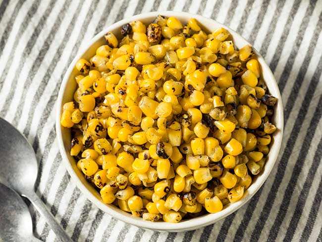 Organic yellow roasted sweet corn in a bowl