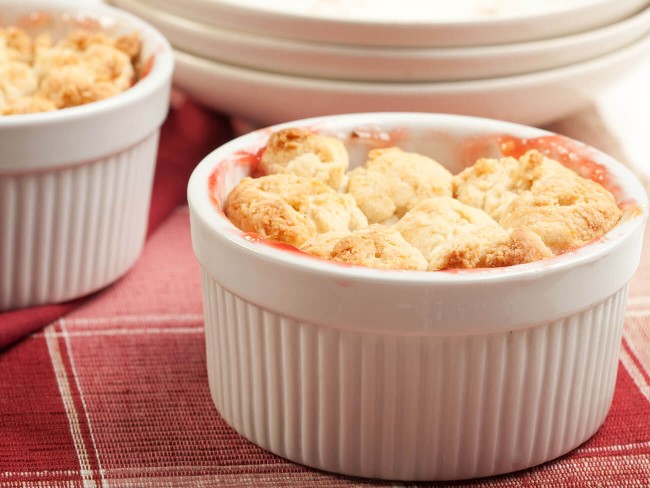 Strawberry rhubarb pie in a white dish